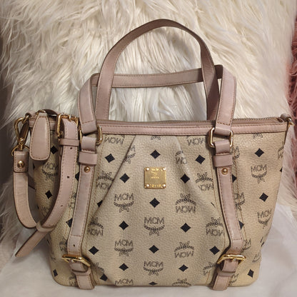 MCM Visetos Leather Monogram bag w/crossbody strap in pale rose and cream.Shop now for the elegant MCM Visetos bag in cream & pale rose. Excellent condition with gold hardware. Perfect classic accessory.$599.00Boston304