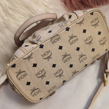 MCM Visetos Leather Monogram bag w/crossbody strap in pale rose and cream.Shop now for the elegant MCM Visetos bag in cream & pale rose. Excellent condition with gold hardware. Perfect classic accessory.$599.00Boston304