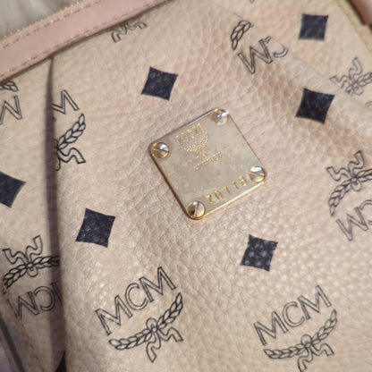 MCM Visetos Leather Monogram bag w/crossbody strap in pale rose and cream.Shop now for the elegant MCM Visetos bag in cream & pale rose. Excellent condition with gold hardware. Perfect classic accessory.$599.00Boston304