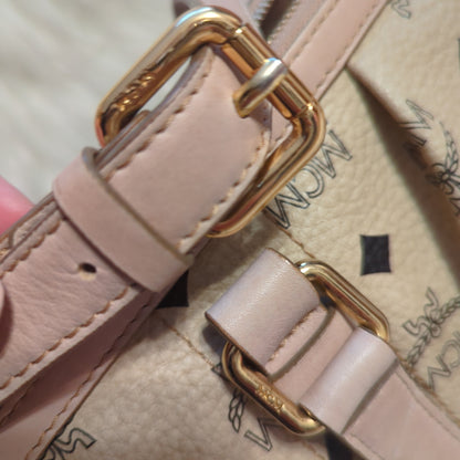 MCM Visetos Leather Monogram bag w/crossbody strap in pale rose and cream.Shop now for the elegant MCM Visetos bag in cream & pale rose. Excellent condition with gold hardware. Perfect classic accessory.$599.00Boston304