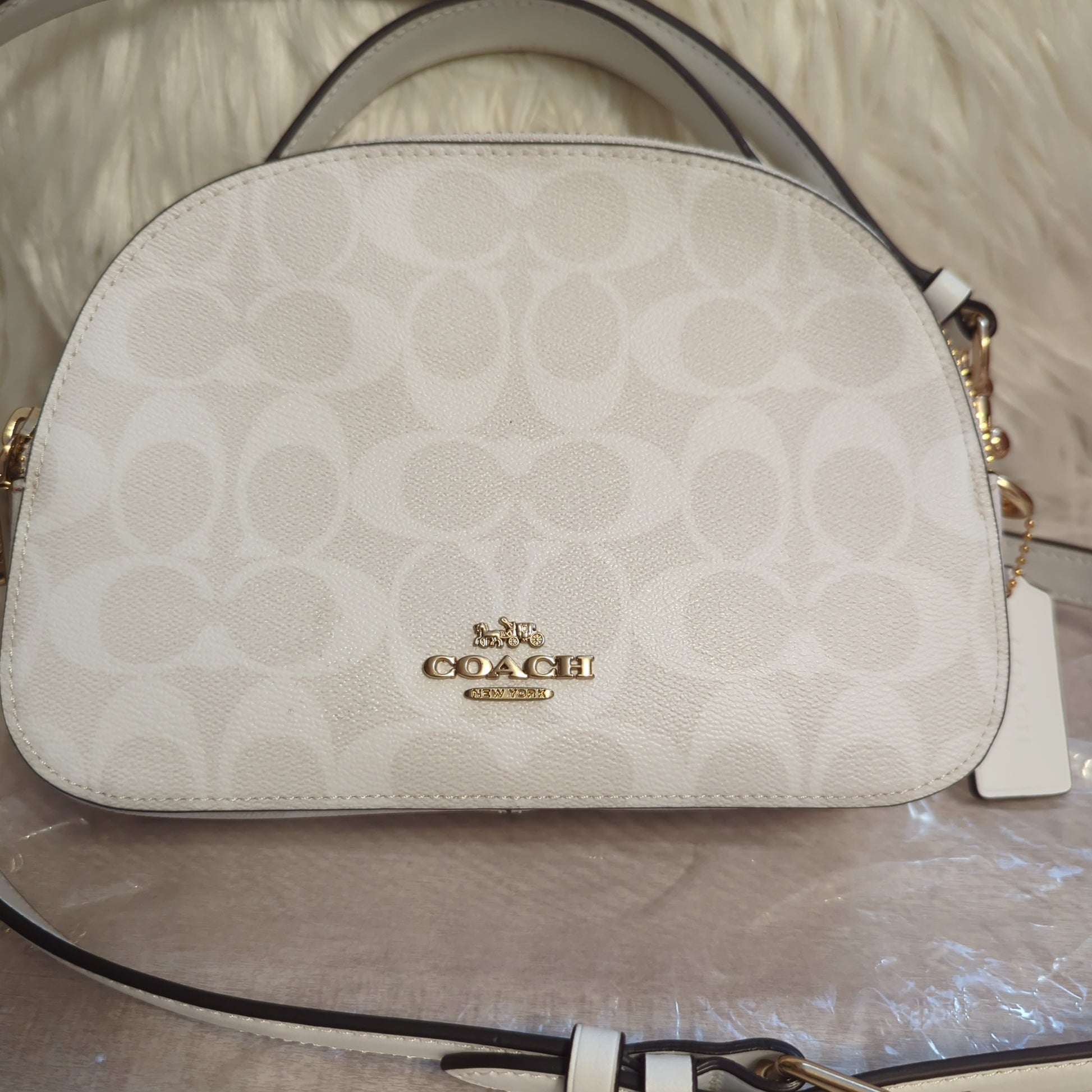 Coach Signature Serena crossbody satchel 2way bag in chalk/glacier whiteShop the iconic Coach Serena in chalk & glacier white. Features gold hardware & two compartments for style and function.$269.00Boston304