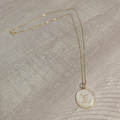 Louis Vuitton white charm on 20 inch 18k gold plated chainBeautiful authentic Louis Vuitton white charm upcycled to a necklace on a 20" 18k plated gold chain. This charm is a perfect 1 inch size.$199.00Boston304