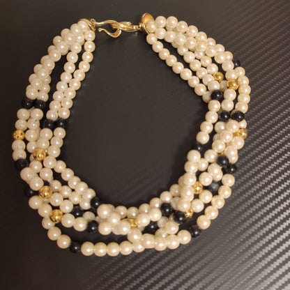 Vintage 5 strand faux pearl necklaceElevate your style with this classy vintage 5-strand Richelieu faux pearl necklace. Perfect condition, timeless elegance.$185.00Boston304