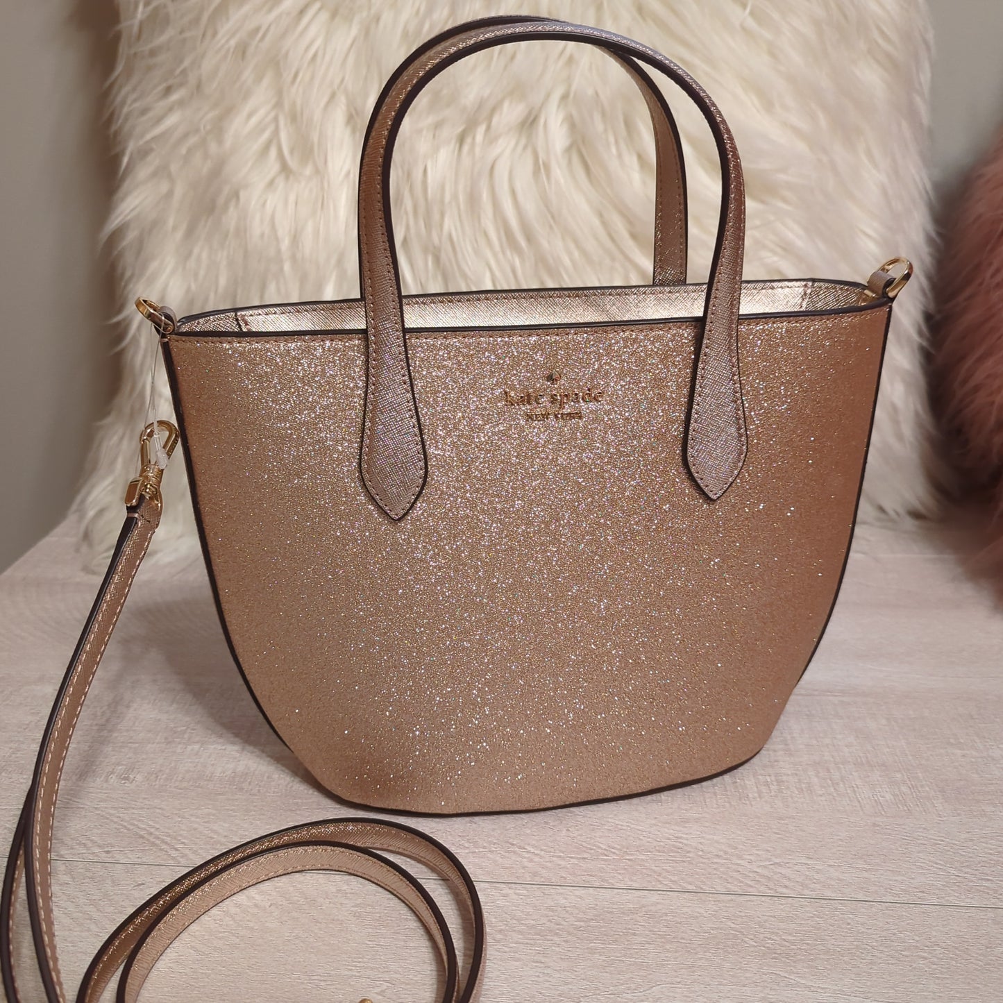 Kate Spade Gold Glimmer SatchelElevate your style with the Kate Spade Gold Glimmer Satchel. Versatile crossbody with elegant shimmer, gold hardware & top zip. Shop now!$199.00Boston304