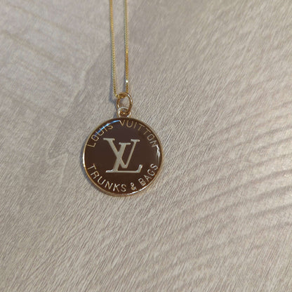 Louis Vuitton brown charm on 20 inch 18k plated necklaceBeautiful Louis Vuitton charm upcycled to a 20 inch 18k plated necklace in a gorgeous chocolate brown and gold. Perfect one inch charm.$199.00Boston304