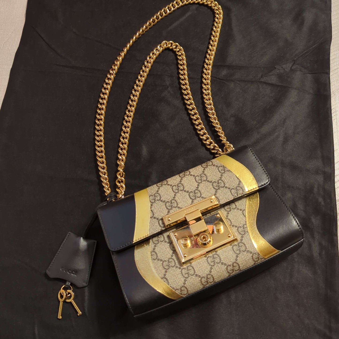 Gucci Padlock Bag GG Supreme Canvas and Black leatherElegant Gucci Padlock Bag in GG Supreme Canvas with black leather and gold trim. Light pink lining, good condition with slight wear.$1595.00Boston304