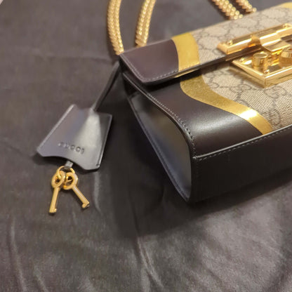 Gucci Padlock Bag GG Supreme Canvas and Black leatherElegant Gucci Padlock Bag in GG Supreme Canvas with black leather and gold trim. Light pink lining, good condition with slight wear.$1595.00Boston304