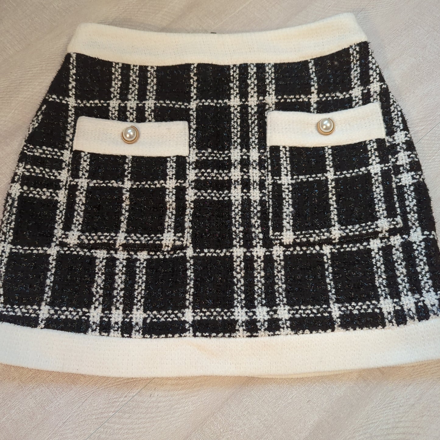 Dance&Marvel shimmery tweed skirt with faux pearl accentsElevate your style with Dance&Marvel's shimmery black & cream tweed skirt. Chic faux pearls, comfy trim. Perfect pre-loved condition.$55.00Boston304