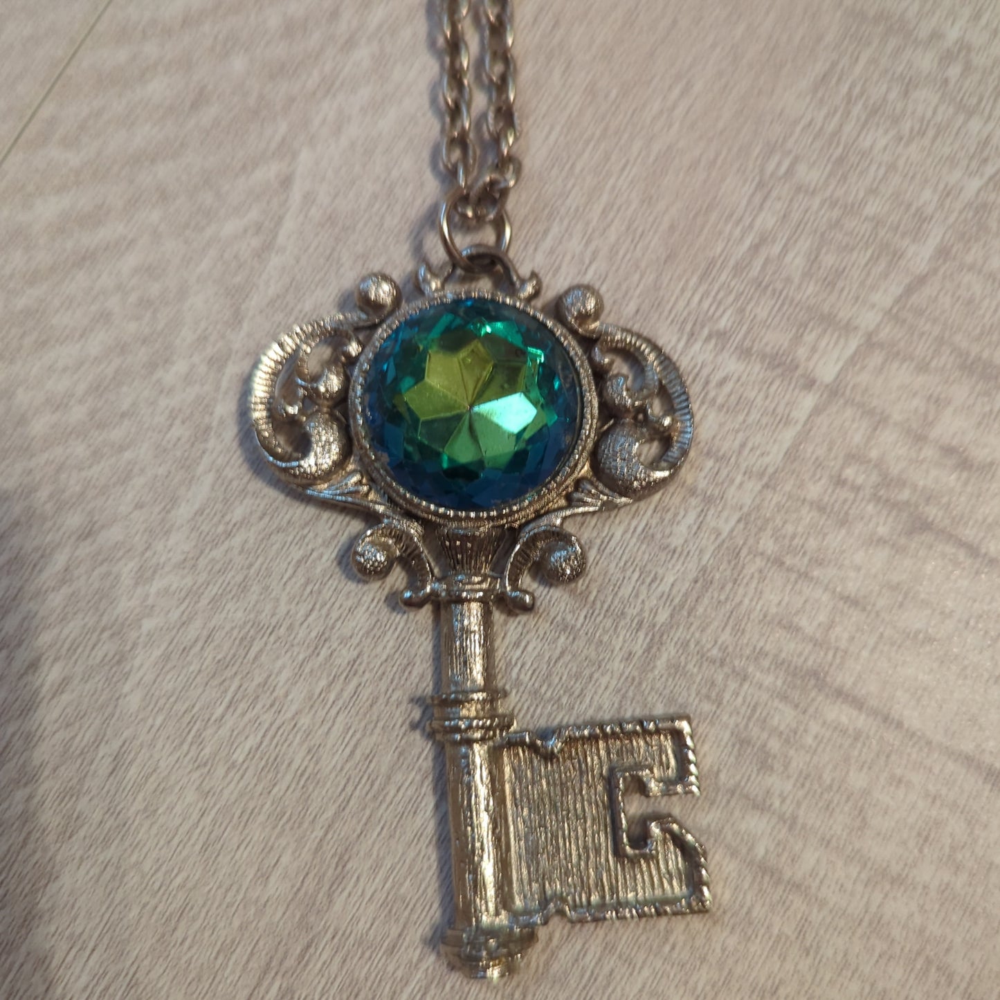 Vintage Gemstone Key NecklaceOwn a piece of elegance with our Vintage Key Necklace featuring a stunning, multicolored gemstone. Perfect charm for timeless style!$99.00Boston304