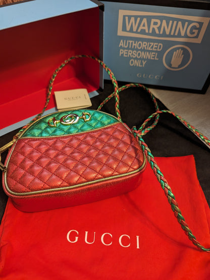 Gucci Trapuntata Quilted Metallic Calfskin Leather Crossbody Bag. Red, Gold, Green.Exclusive Gucci Trapuntata quilted bag in metallic red, gold & green. Mint with full inclusion. Shop your Italian-crafted luxury now!$1399.00Boston304