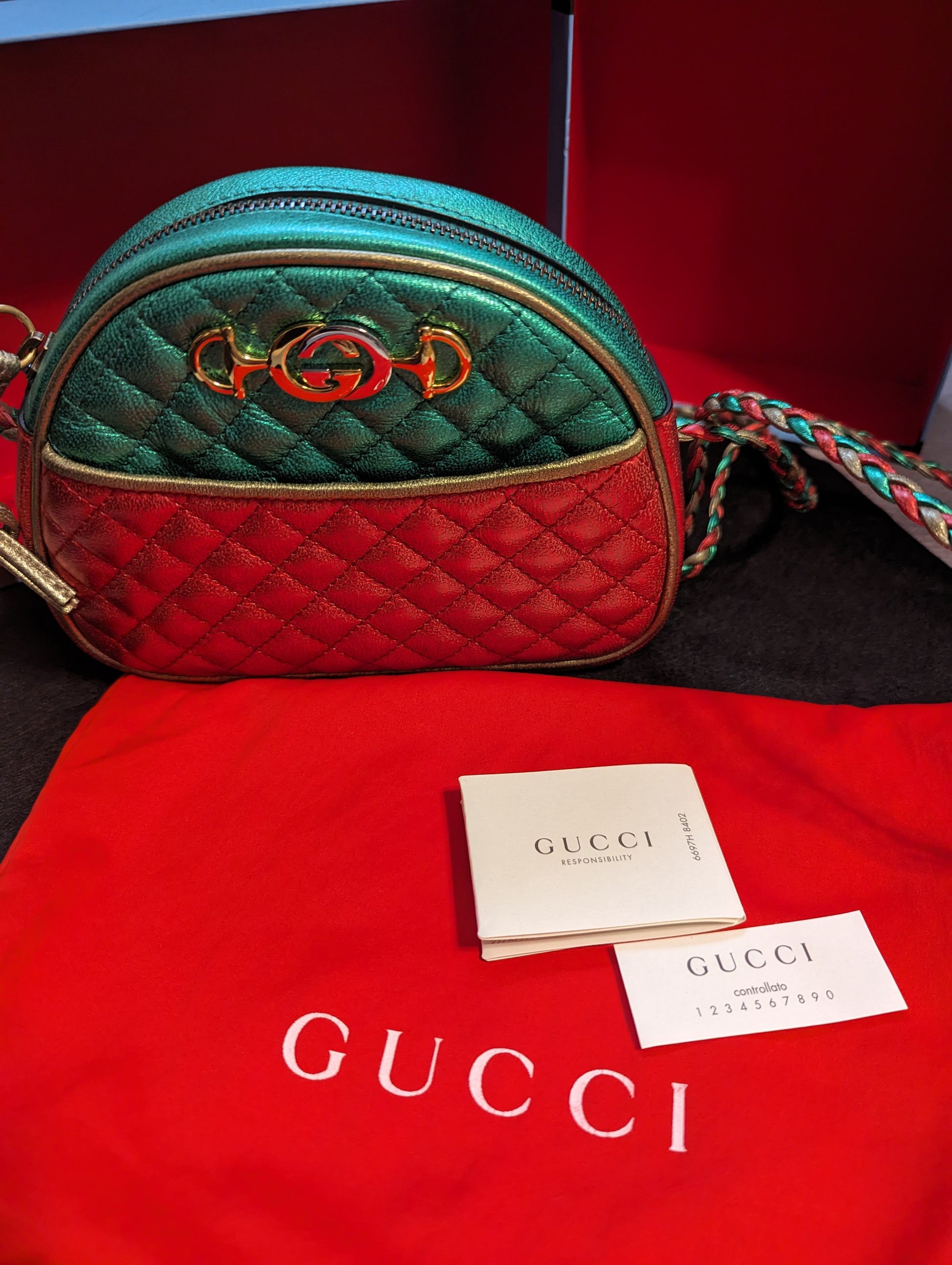 Gucci Trapuntata Quilted Metallic Calfskin Leather Crossbody Bag. Red, Gold, Green.Exclusive Gucci Trapuntata quilted bag in metallic red, gold & green. Mint with full inclusion. Shop your Italian-crafted luxury now!$1399.00Boston304