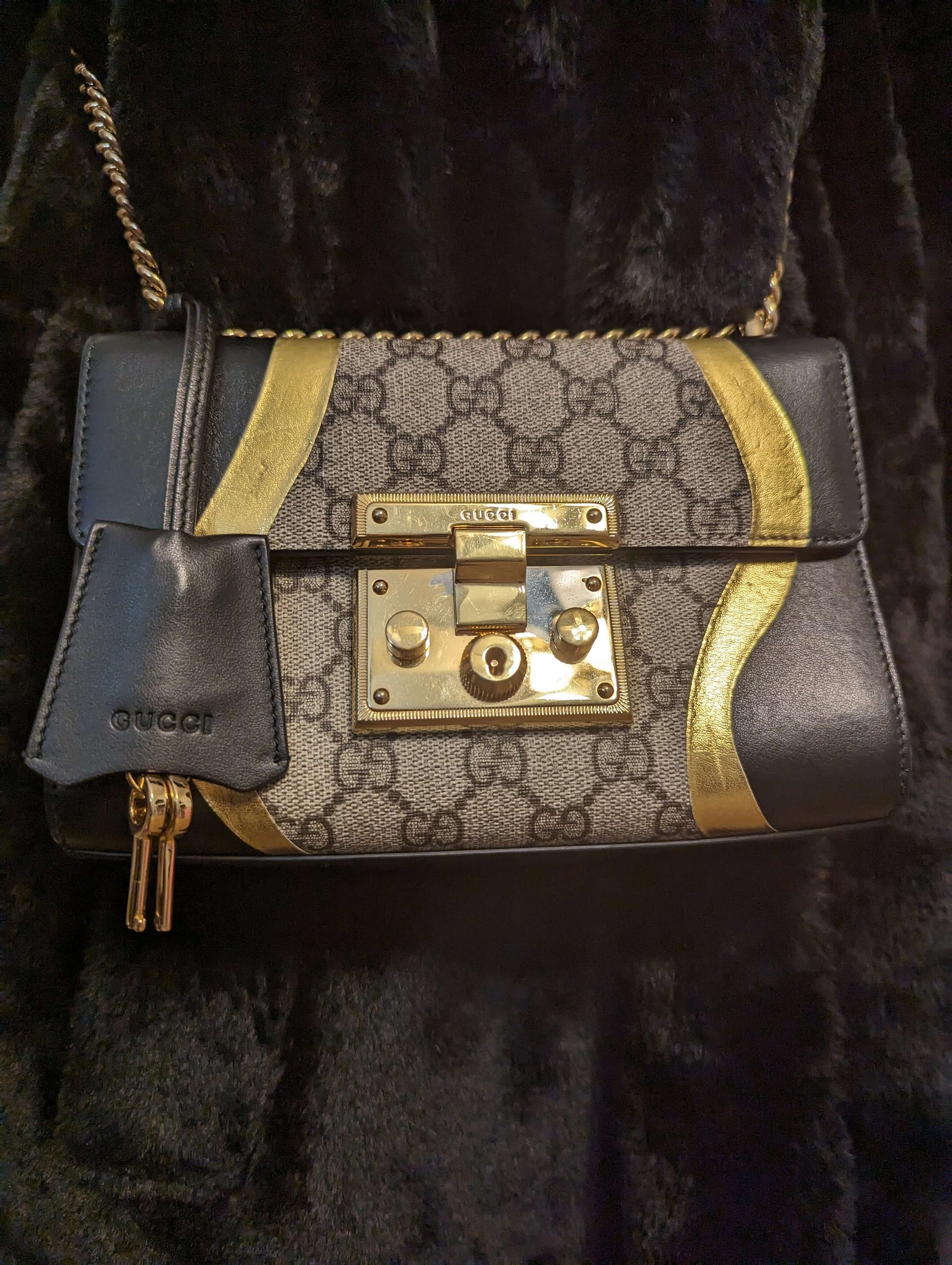 Gucci Padlock Bag GG Supreme Canvas and Black leatherElegant Gucci Padlock Bag in GG Supreme Canvas with black leather and gold trim. Light pink lining, good condition with slight wear.$1595.00Boston304