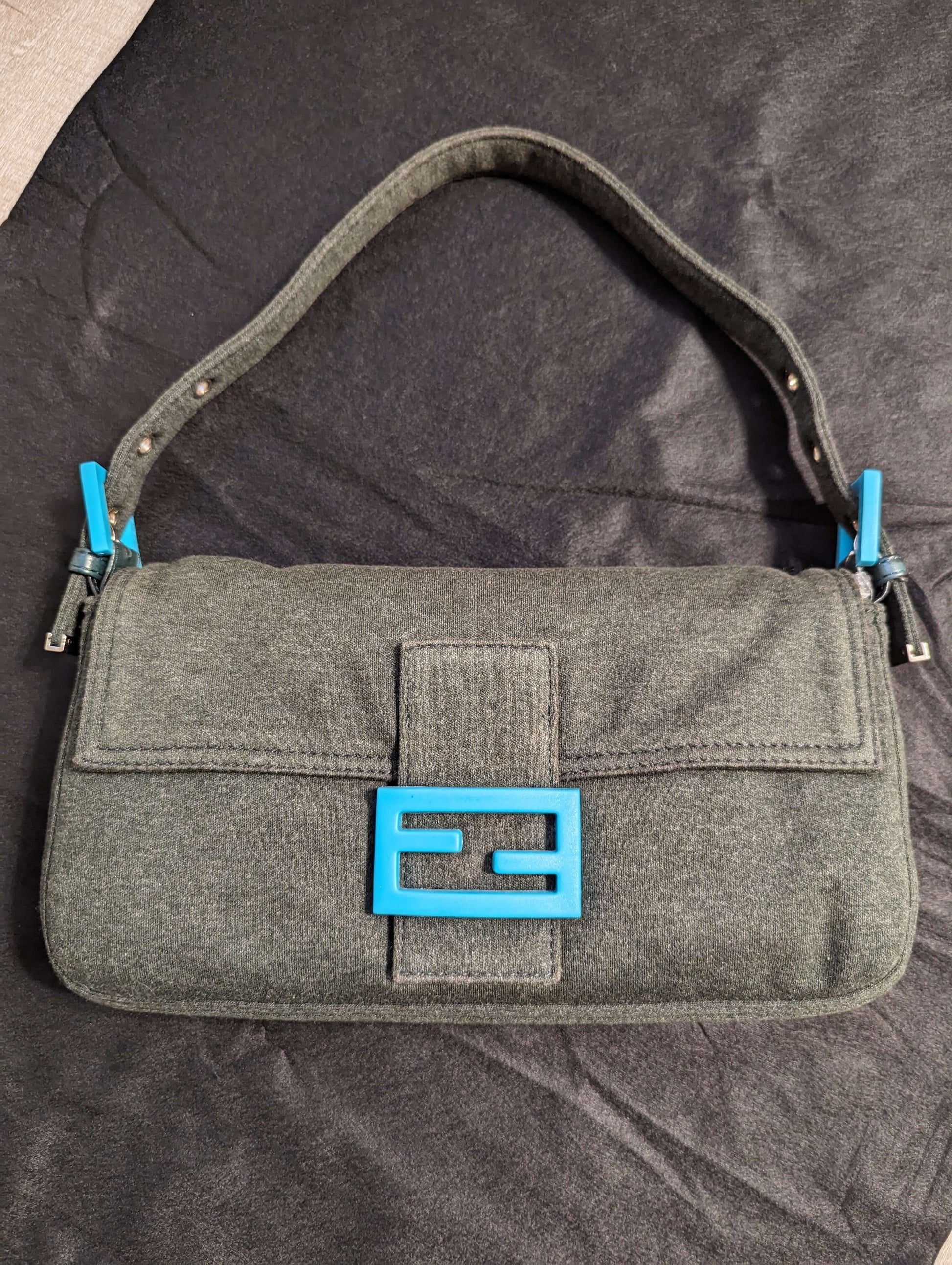 Fendi Mamback Shoulder BagShop the pristine Fendi Mamback Shoulder Bag with dark olive & teal accents. Cert of authenticity & dust bag included. Get yours now!$1295.00Boston304