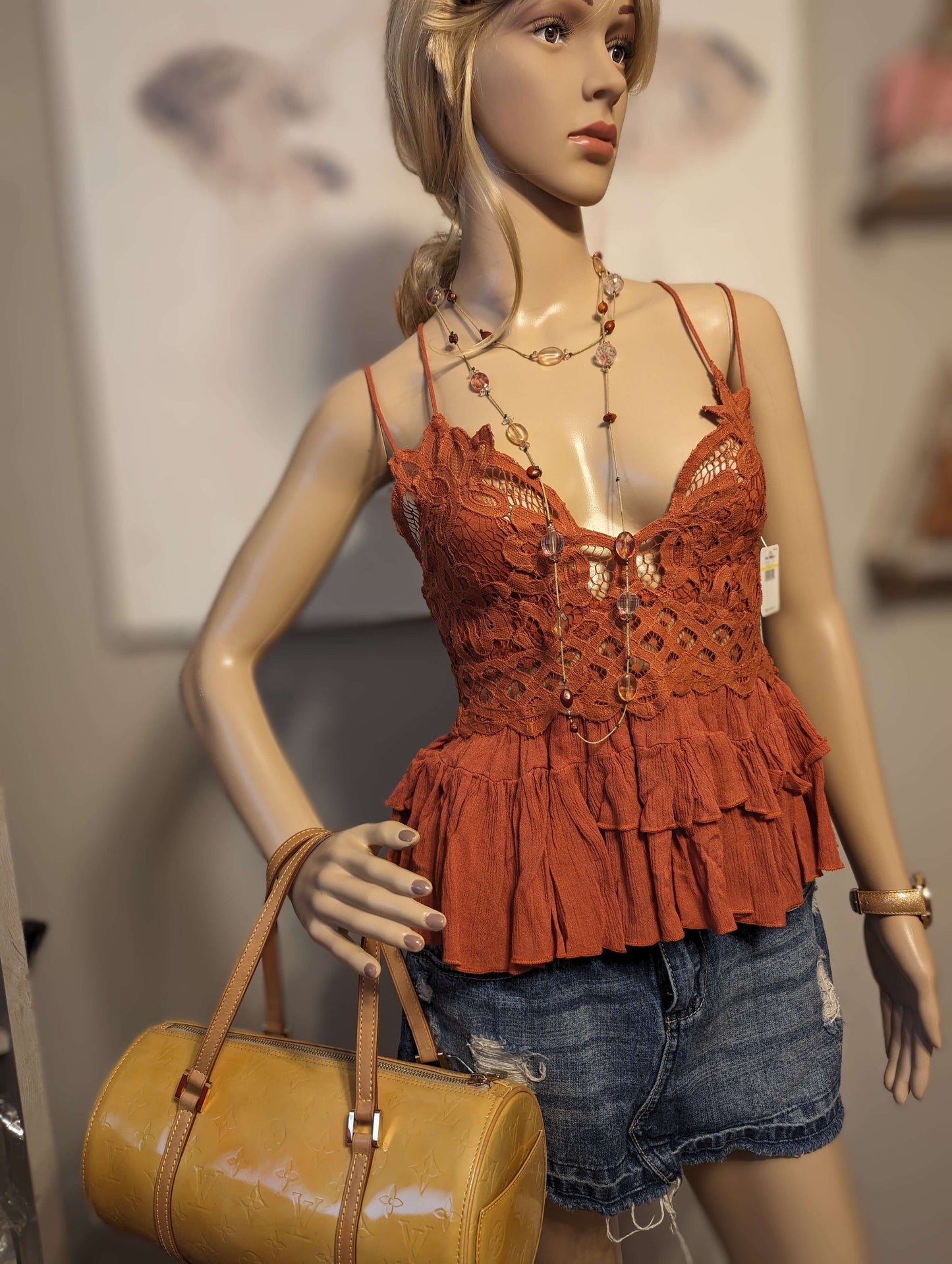 Free People Adella Top in color winding roadsShop the rust-hued Free People Adella Top with adjustable straps for a perfect medium fit. Embrace elegance with the 'Winding Roads' color.$48.00Boston304