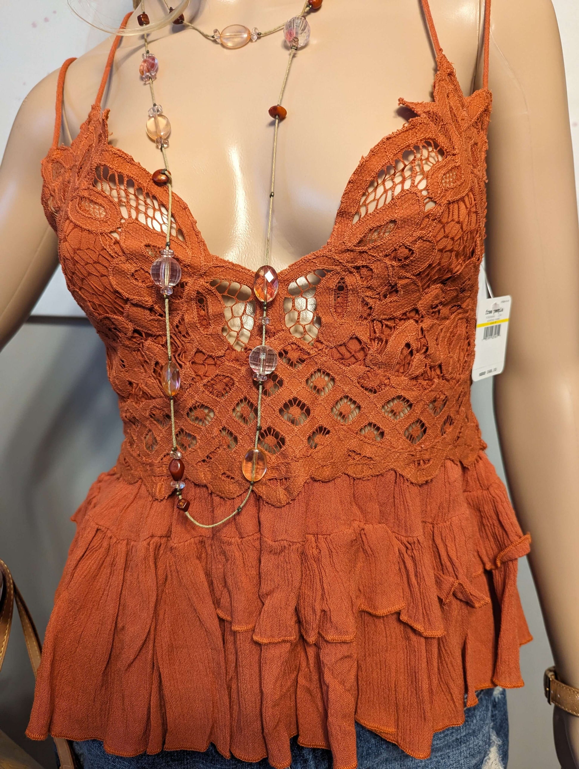 Free People Adella Top in color winding roadsShop the rust-hued Free People Adella Top with adjustable straps for a perfect medium fit. Embrace elegance with the 'Winding Roads' color.$48.00Boston304