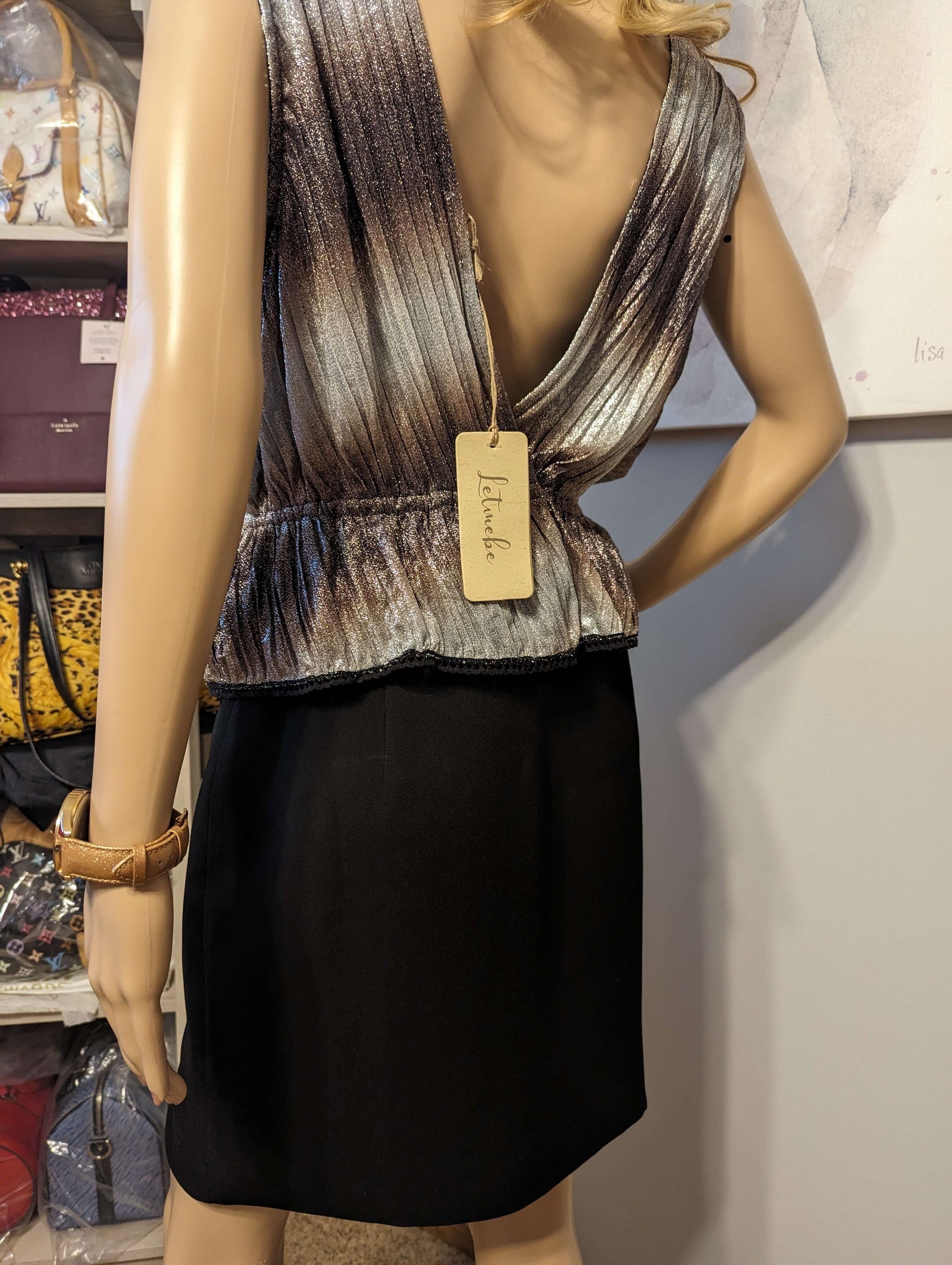 Letmebe hand crafted shimmery topDazzle in Letmebe's shimmery handcrafted top. Perfect fit with a cinched waist & stretch, comfortably lined. Shop now for a stunning look!$125.00Boston304