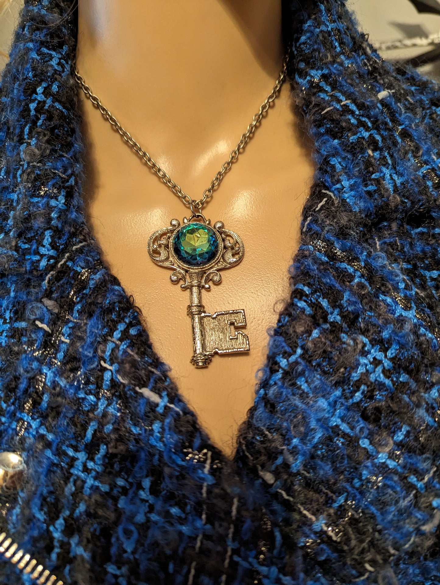 Vintage Gemstone Key NecklaceOwn a piece of elegance with our Vintage Key Necklace featuring a stunning, multicolored gemstone. Perfect charm for timeless style!$99.00Boston304