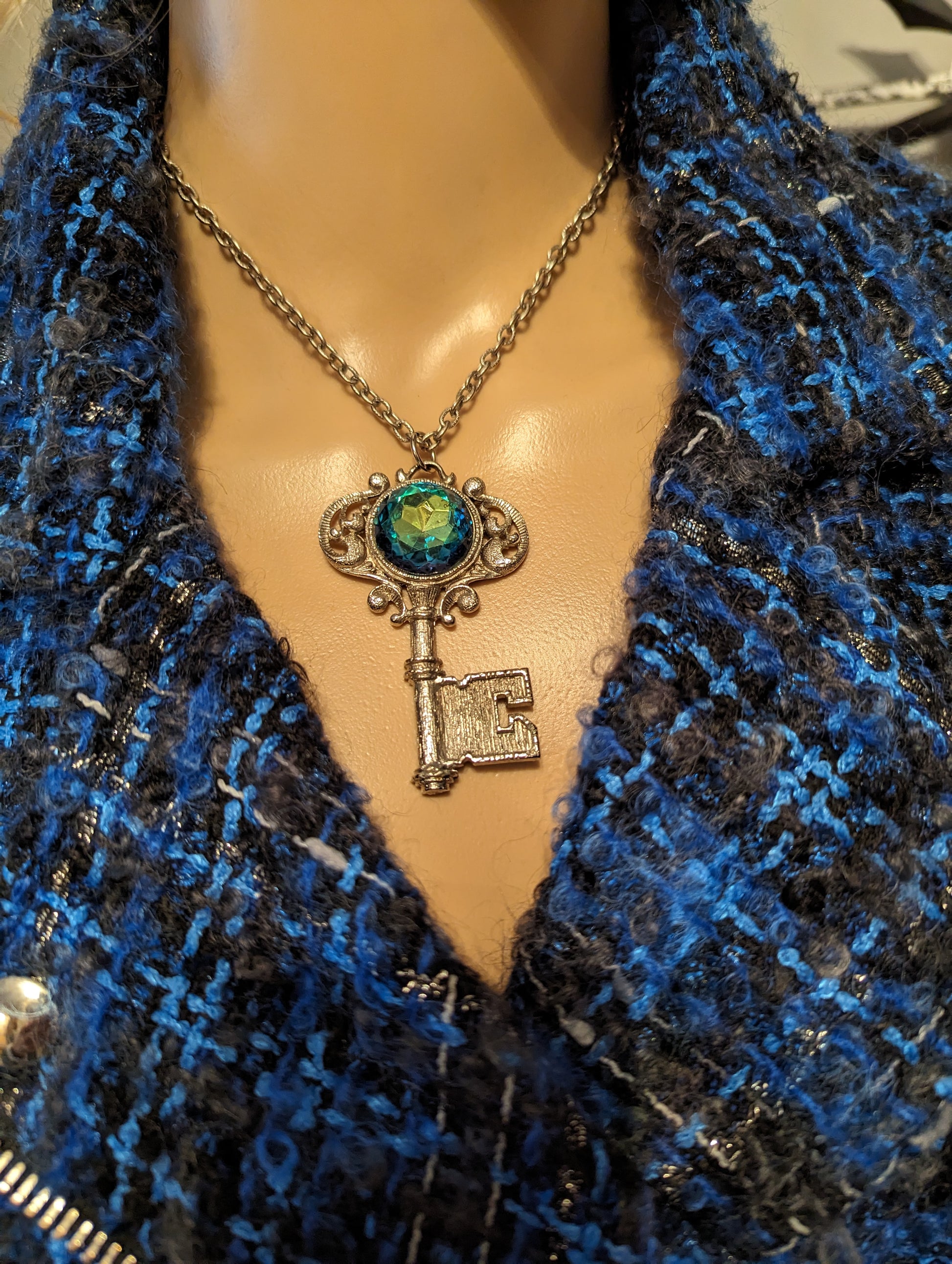 Vintage Gemstone Key NecklaceOwn a piece of elegance with our Vintage Key Necklace featuring a stunning, multicolored gemstone. Perfect charm for timeless style!$99.00Boston304