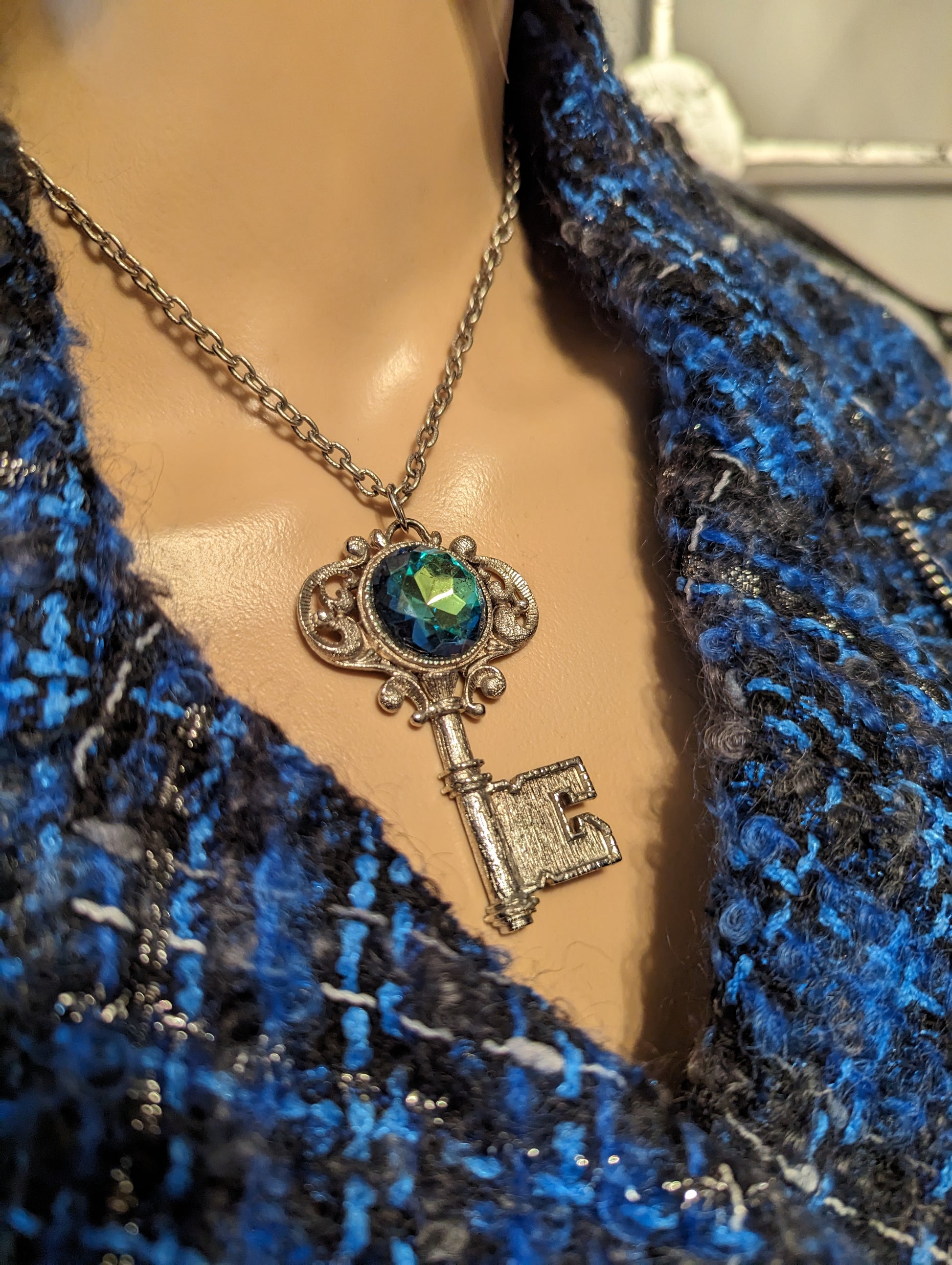 Vintage Gemstone Key NecklaceOwn a piece of elegance with our Vintage Key Necklace featuring a stunning, multicolored gemstone. Perfect charm for timeless style!$99.00Boston304