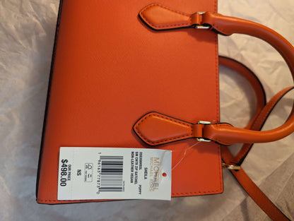 Michael Kors Sheila Center Zip Non Leather Vegan Crossbody Satchel in PoppyGet the chic Poppy Michael Kors Sheila Vegan Satchel. Gold accents, removable strap, and smart compartments. Perfect size at 9x6x3.$369.00Boston304