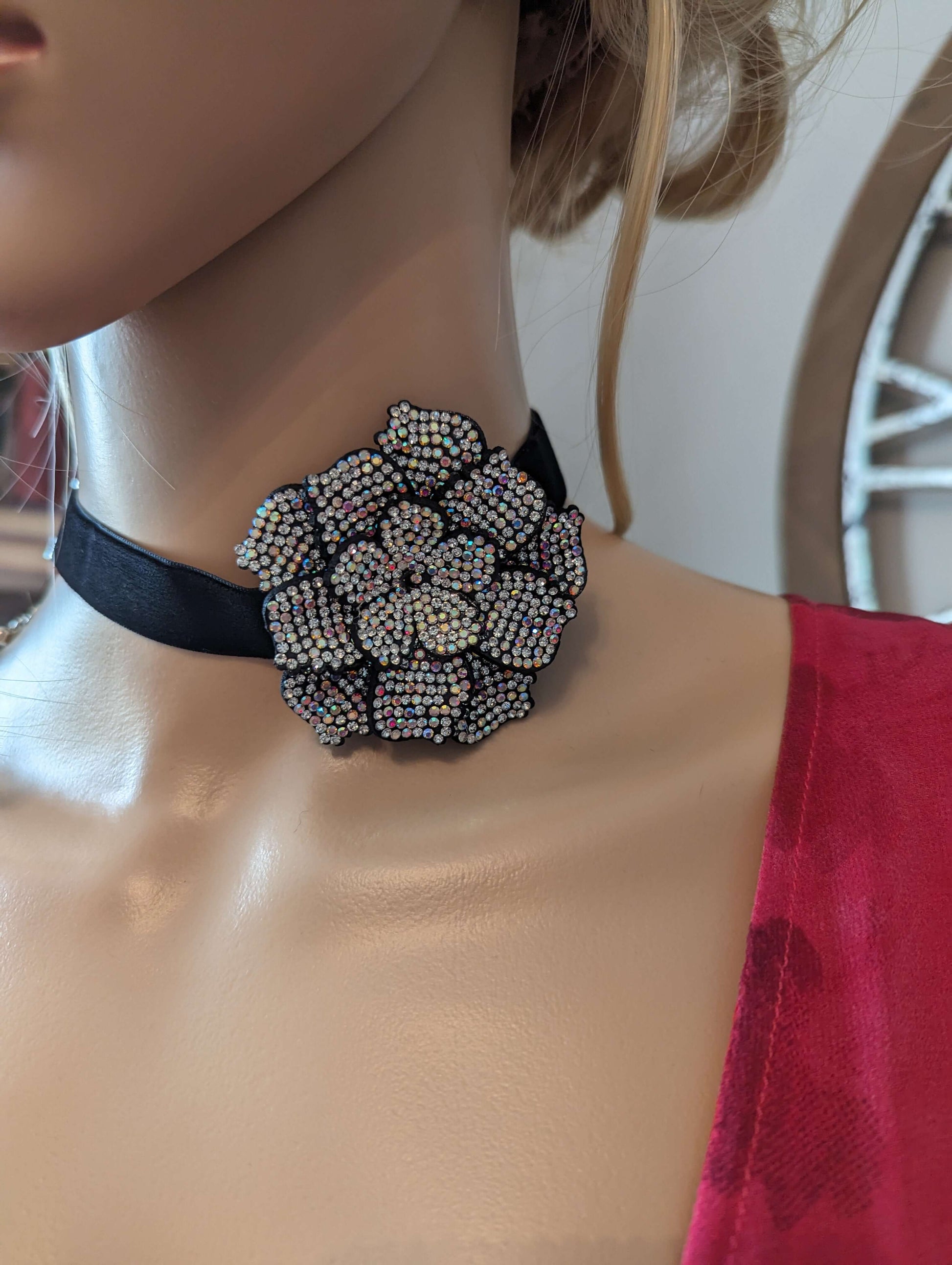 Camellia flower rhinestone necklaceDazzle in a Camellia flower rhinestone necklace, perfect as a neck or wrist accessory. Adjustable, iridescent stones add a touch of glam!$29.00Boston304