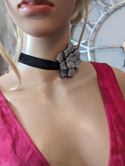 Camellia flower rhinestone necklaceDazzle in a Camellia flower rhinestone necklace, perfect as a neck or wrist accessory. Adjustable, iridescent stones add a touch of glam!$29.00Boston304