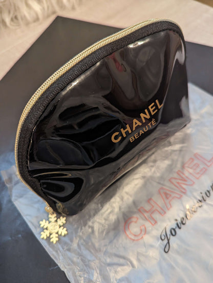 Chanel Beaute patent leather beauty bagElevate your makeup game with the Chanel Beaute black & gold beauty bag, featuring luxe patent leather and a chic snowflake zipper.$139.00Boston304