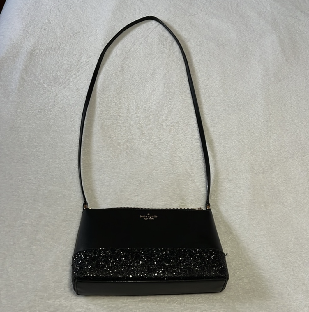 Kate Spade crossbody bag in black crossgrain leather with black glitter detailShop the pristine Kate Spade crossbody in black leather with glitter. Perfect size at 9x6. Elevate your style with this like-new gem.$179.00Boston304