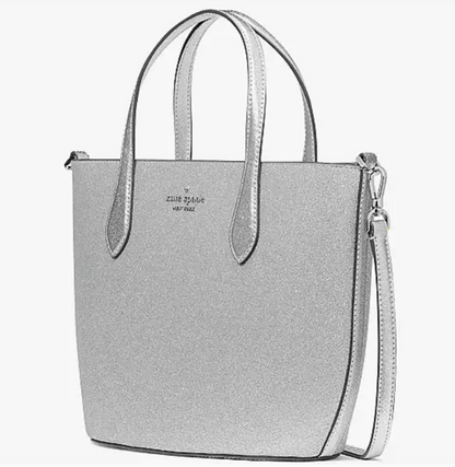 Kate Spade glimmer satchel in Lunar LightShine with Kate Spade Lunar Light Glimmer Satchel. Silver shimmer, sleek design, versatile straps. Perfect size 11x8x4. Limited availability!$199.00Boston304