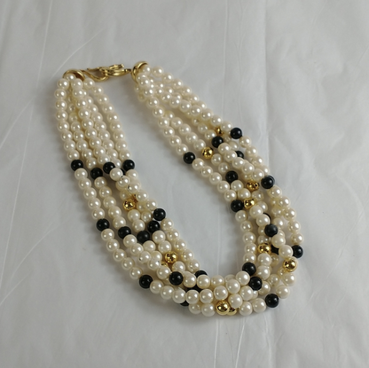 Vintage 5 strand faux pearl necklaceElevate your style with this classy vintage 5-strand Richelieu faux pearl necklace. Perfect condition, timeless elegance.$185.00Boston304