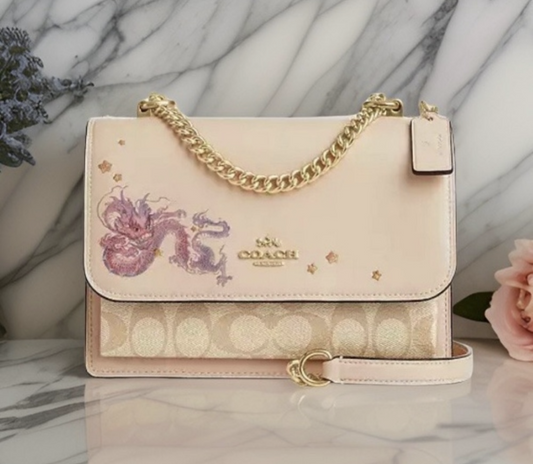 Coach Lunar New Year Klare Crossbody, Year of the DragonEmbrace the Lunar New Year with Coach's Dragon Klare Crossbody. Exquisite design in canvas with a gold-tone chain for elegance.$299.00Boston304