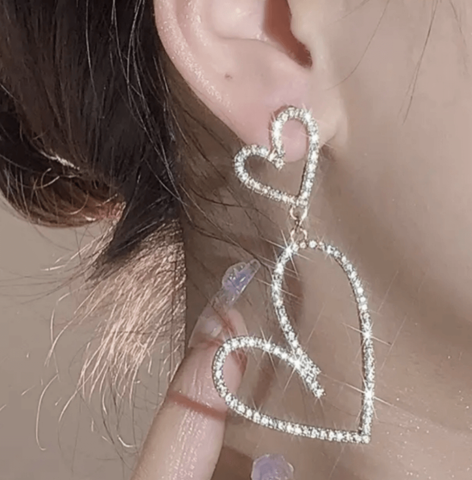 Rhinestone heart dangle earringsElevate your style with these sparkly, lightweight rhinestone heart dangle earrings. Perfect for adding a touch of glam! Shop now.$25.00Boston304