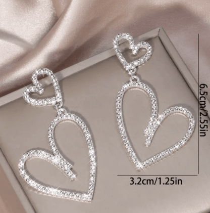 Rhinestone heart dangle earringsElevate your style with these sparkly, lightweight rhinestone heart dangle earrings. Perfect for adding a touch of glam! Shop now.$25.00Boston304