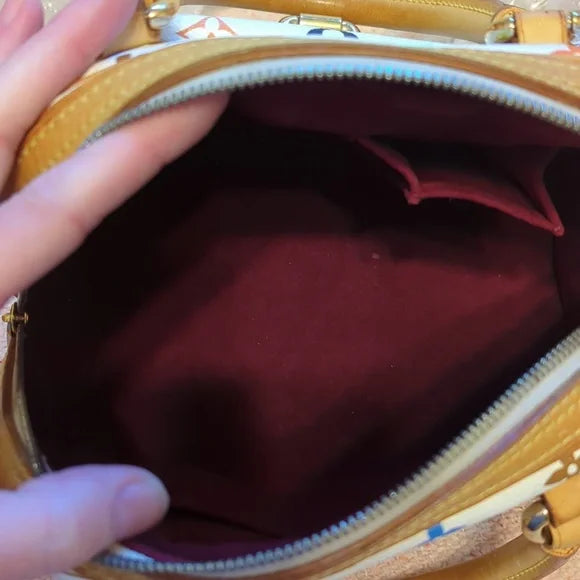 Louis Vuitton Murakami PriscillaOwn the exquisite Louis Vuitton Murakami Priscilla bag, in excellent condition with authenticity certificate. A timeless luxury piece.$1799.00Boston304