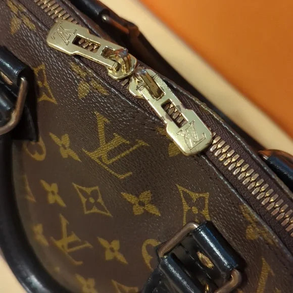 Louis Vuitton Alma BagShop the refurbished Louis Vuitton Alma Bag from Sep 1995. Iconic design, durable vachetta leather, includes charm & strap.$1149.00Boston304