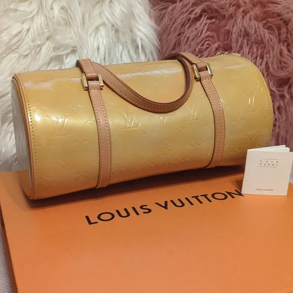 Louis Vuitton Cuir VerniElevate your style with the Louis Vuitton Cuir Verni - a glossy, yellow/gold handbag featuring quality craftsmanship and an original LV booklet.$599.00Boston304