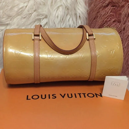 Louis Vuitton Cuir VerniElevate your style with the Louis Vuitton Cuir Verni - a glossy, yellow/gold handbag featuring quality craftsmanship and an original LV booklet.$599.00Boston304