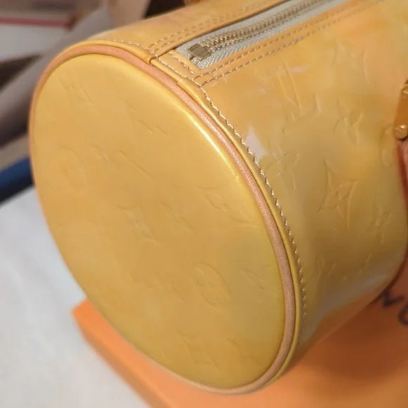 Louis Vuitton Cuir VerniElevate your style with the Louis Vuitton Cuir Verni - a glossy, yellow/gold handbag featuring quality craftsmanship and an original LV booklet.$599.00Boston304