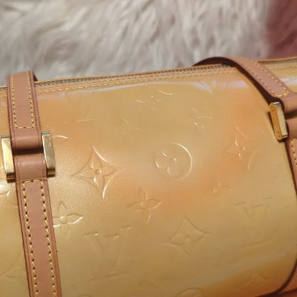 Louis Vuitton Cuir VerniElevate your style with the Louis Vuitton Cuir Verni - a glossy, yellow/gold handbag featuring quality craftsmanship and an original LV booklet.$599.00Boston304