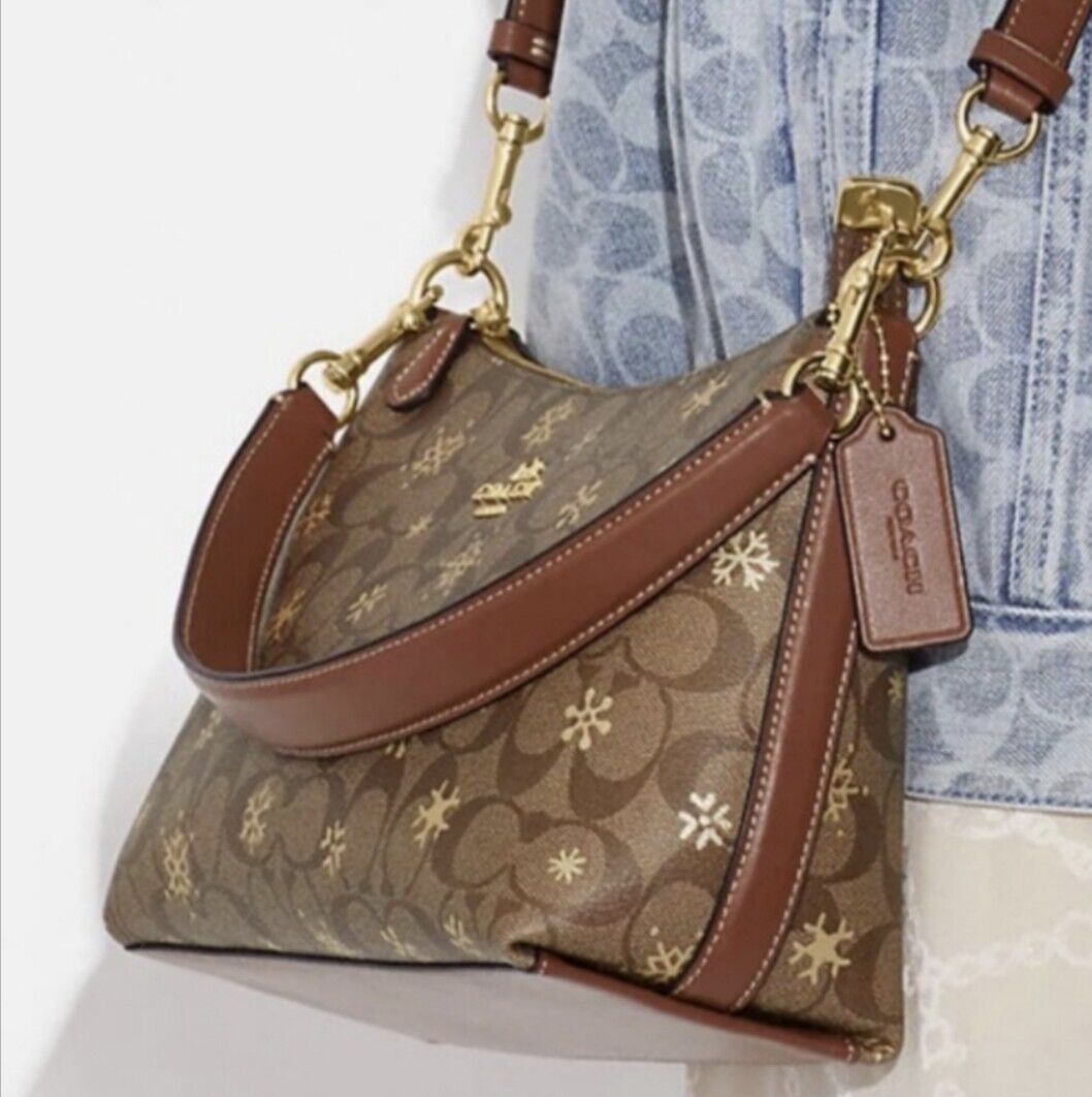 COACH Clara Shoulder Bag In Signature Canvas Leather With Snowflake Print NWTElevate your style this winter with the COACH Clara Shoulder Bag. Signature canvas and snowflake print offer charm and functionality.$165.75Boston304