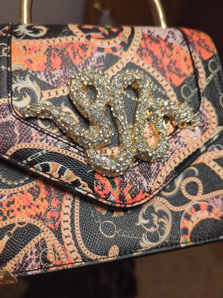 Aldo Premium Rare Rhinestone Snake BagElevate your style with the Aldo Premium Rare Rhinestone Snake Bag. Dazzling, luxurious, and perfect for any occasion.$159.00Boston304