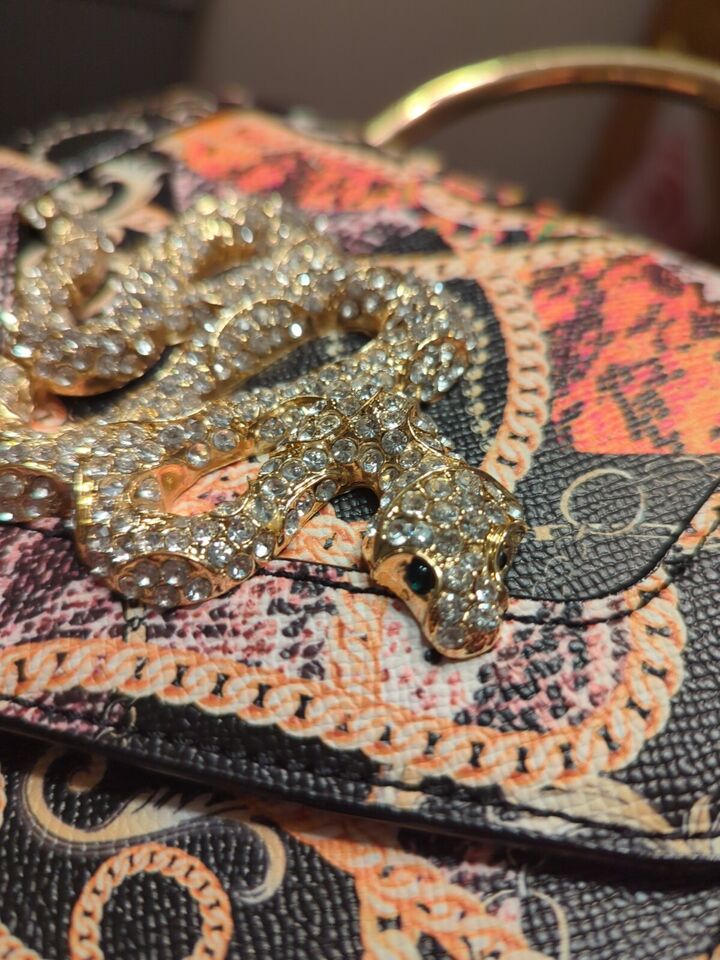 Aldo Premium Rare Rhinestone Snake BagElevate your style with the Aldo Premium Rare Rhinestone Snake Bag. Dazzling, luxurious, and perfect for any occasion.$159.00Boston304