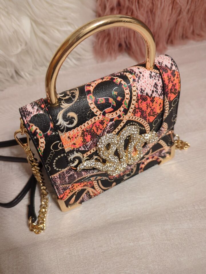 Aldo Premium Rare Rhinestone Snake BagElevate your style with the Aldo Premium Rare Rhinestone Snake Bag. Dazzling, luxurious, and perfect for any occasion.$159.00Boston304