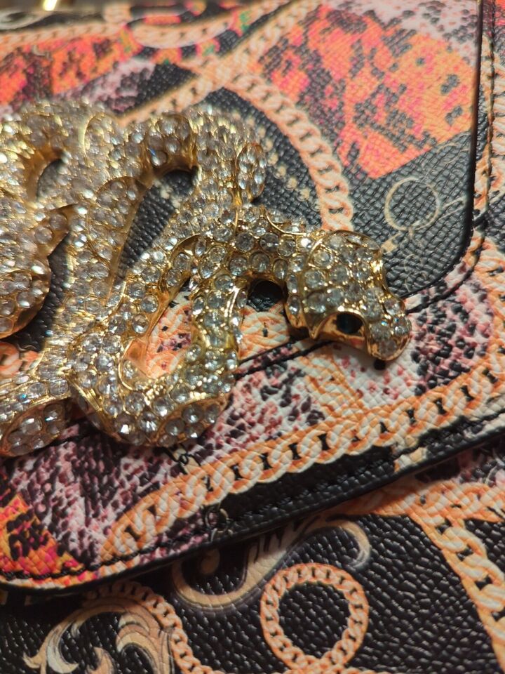 Aldo Premium Rare Rhinestone Snake BagElevate your style with the Aldo Premium Rare Rhinestone Snake Bag. Dazzling, luxurious, and perfect for any occasion.$159.00Boston304